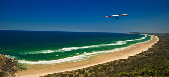 https://mdw-travel-data-us-east-1.s3.amazonaws.com/img/country/Australia/Byron-Bay-Hang-Gliding/img_01.jpg