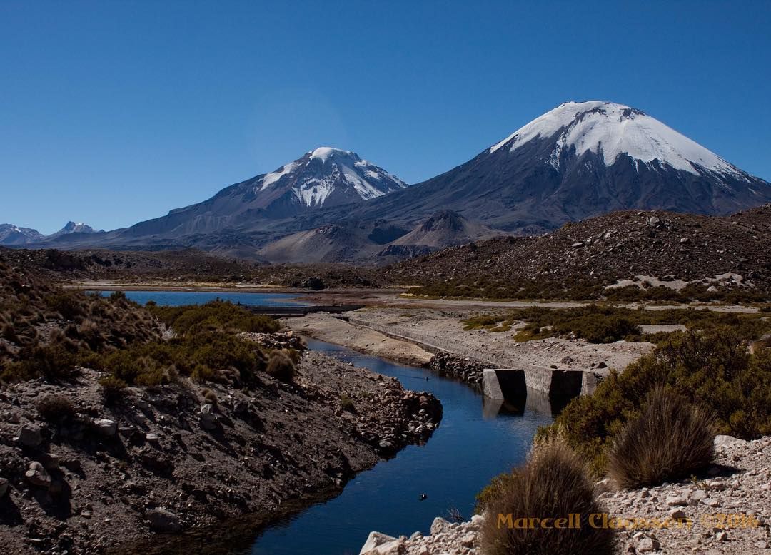 https://mdw-travel-data-us-east-1.s3.amazonaws.com/img/country/Chile/Parinacota-and-Pomerape-Volcanoes/img_01.jpg